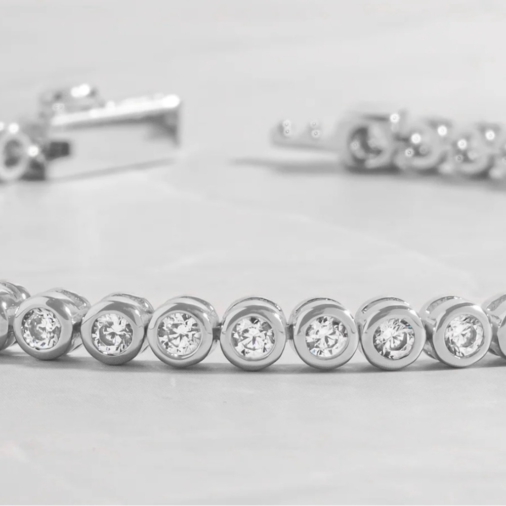 Elegant Silver Tennis Bracelet with Bezel Set Gemstone Design